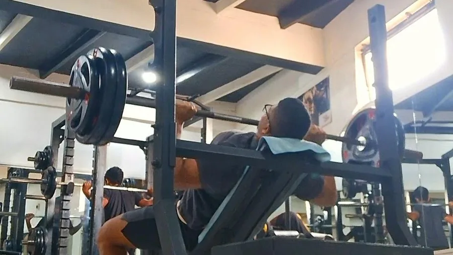 Client performing incline press during strength training